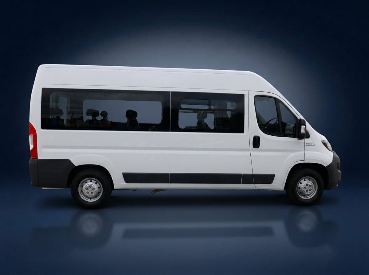 White high-roof minibus, side view